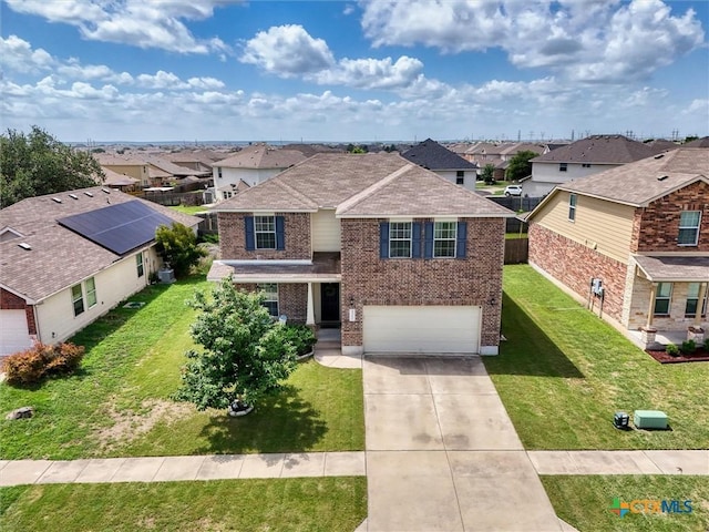 3312 Shawlands Rd, Killeen, TX 76542 - traditional home with brick siding, a residential view, a garage, and concrete driveway
