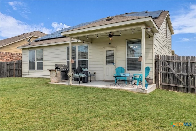 3312 Shawlands Rd, Killeen, TX 76542 - back of property featuring a patio, roof mounted solar panels, a fenced backyard, and ceiling fan