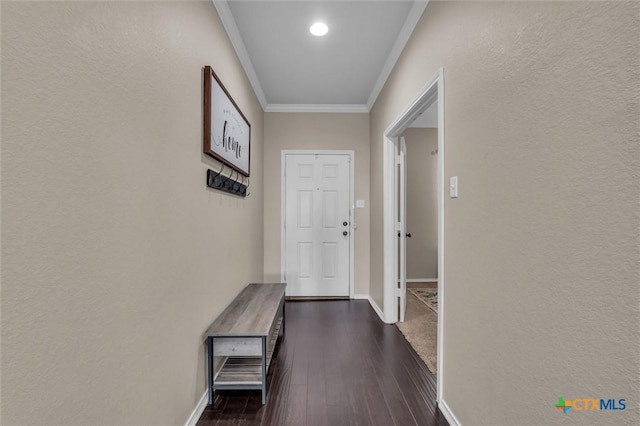 3312 Shawlands Rd, Killeen, TX 76542 - doorway with crown molding, dark wood finished floors, and a textured wall