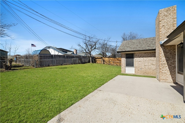 view of yard with a patio area and a fenced backyard