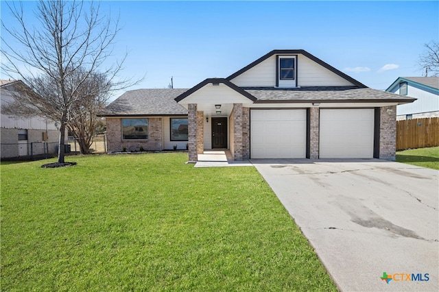 view of front of home featuring brick siding, a front yard, fence, a garage, and driveway