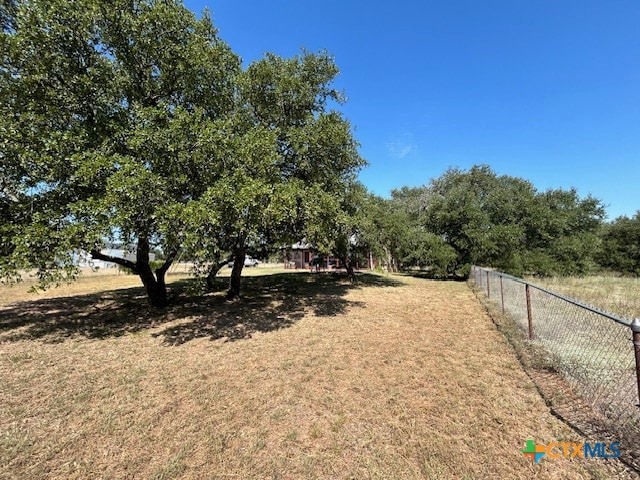 view of yard with a rural view