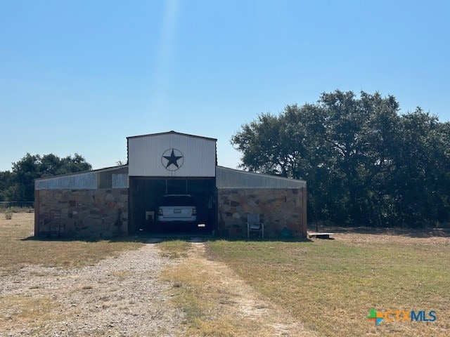 view of outbuilding with a yard