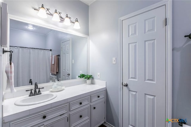 full bath with vanity and toilet