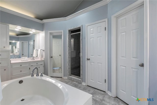 bathroom featuring a bath, a stall shower, vanity, and ornamental molding