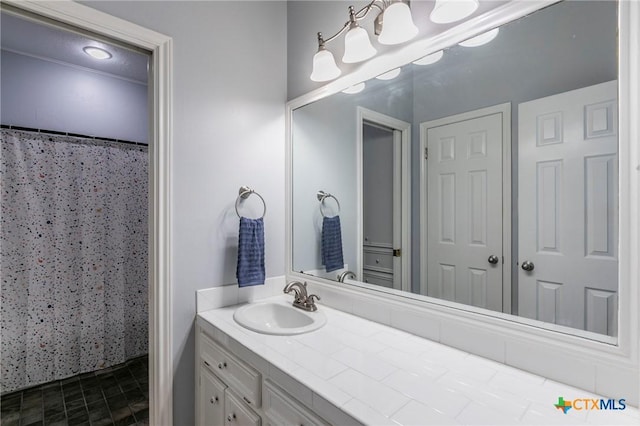 bathroom with a shower with shower curtain and vanity