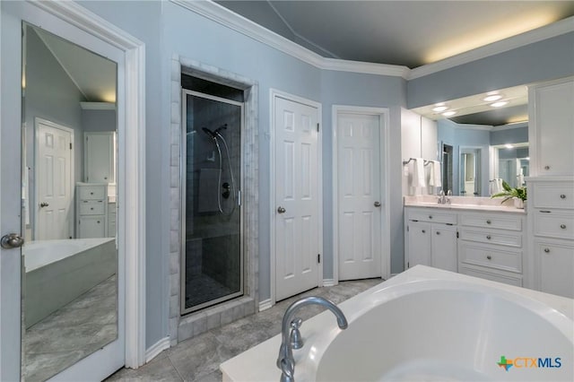 full bathroom featuring ornamental molding, a shower stall, baseboards, a bath, and vanity