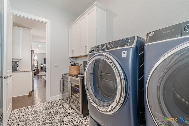 117 Playing Cypress Dr, San Marcos, TX 78666 - laundry room with washer and clothes dryer and cabinet space