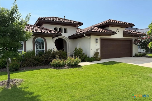 117 Playing Cypress Dr, San Marcos, TX 78666 - mediterranean / spanish house featuring a front lawn, driveway, and an attached garage