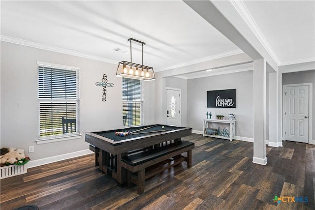 dining room with crown molding, wood finished floors, baseboards, and visible vents