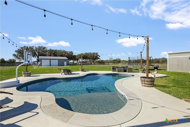 outdoor pool with a yard, a patio, an outdoor structure, and fence