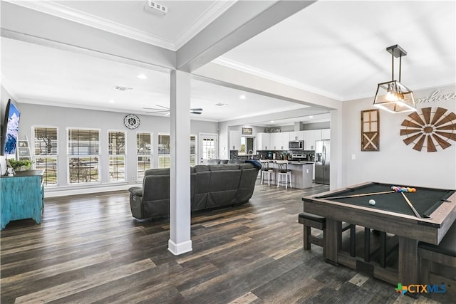 recreation room featuring pool table, ornamental molding, and dark wood-style flooring