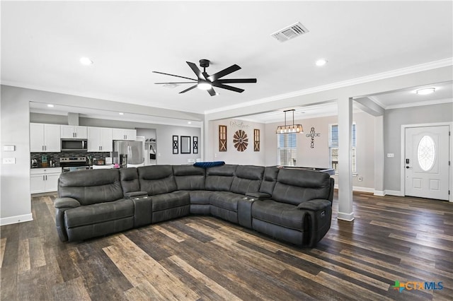 living area with visible vents, baseboards, dark wood-style floors, and a ceiling fan