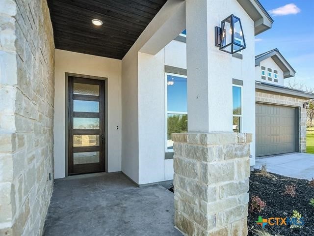 property entrance with a garage