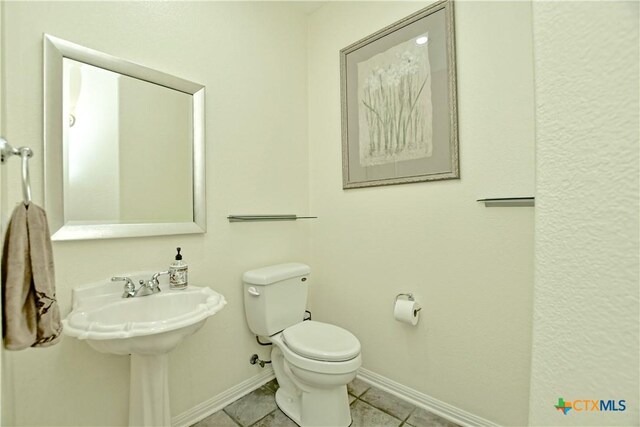 1320 Becca Teal Pl, Round Rock, TX 78681 - bathroom featuring tile patterned flooring, toilet, baseboards, and a sink