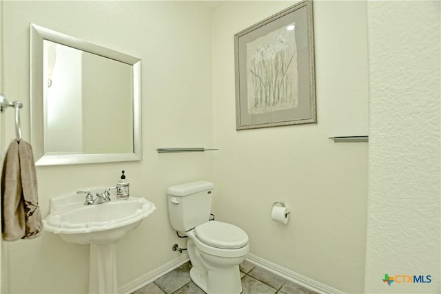 1320 Becca Teal Pl, Round Rock, TX 78681 - bathroom featuring tile patterned flooring, toilet, baseboards, and a sink