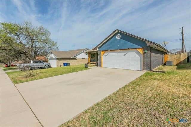 204 Paula St, Copperas Cove, TX 76522 - ranch-style house featuring brick siding, central AC unit, concrete driveway, and a front yard
