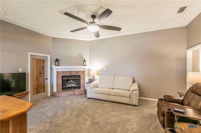 204 Paula St, Copperas Cove, TX 76522 - carpeted living area with a fireplace, a ceiling fan, visible vents, and baseboards