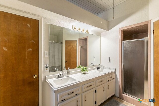 204 Paula St, Copperas Cove, TX 76522 - bathroom with a sink, double vanity, and a shower stall