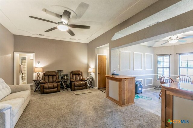 204 Paula St, Copperas Cove, TX 76522 - living area featuring visible vents, light colored carpet, and ceiling fan