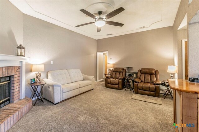 204 Paula St, Copperas Cove, TX 76522 - living area with visible vents, carpet, a brick fireplace, and a ceiling fan