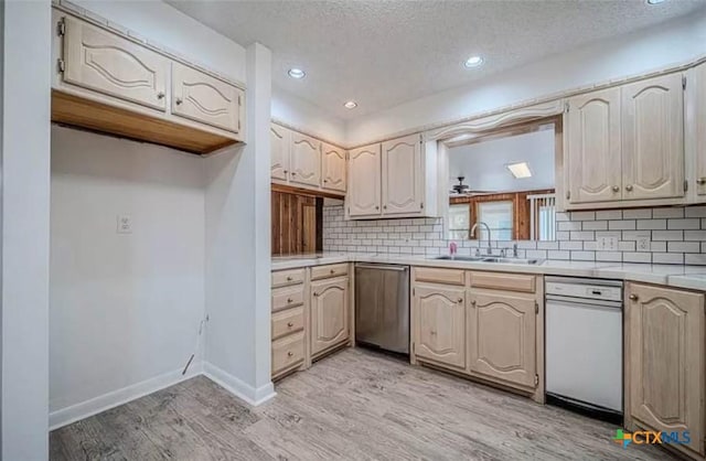 kitchen featuring dishwasher, decorative backsplash, light wood-style flooring, and light countertops