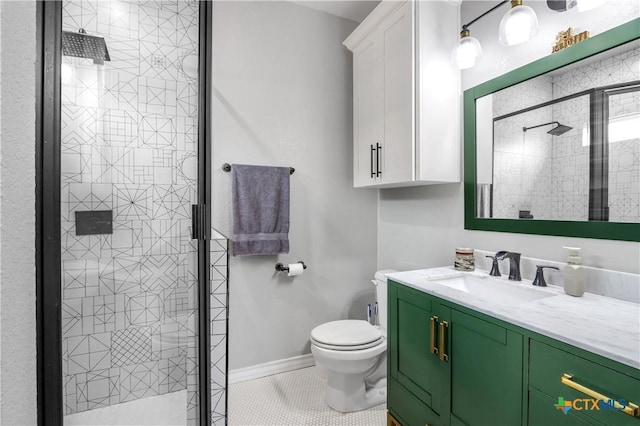 bathroom with vanity, toilet, tile patterned flooring, and a shower stall