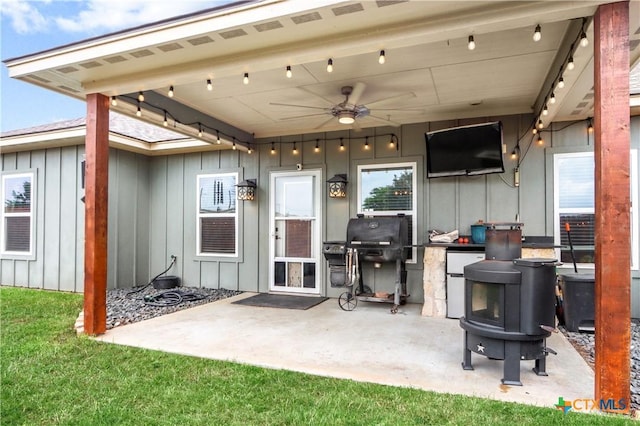 view of patio / terrace featuring area for grilling and ceiling fan