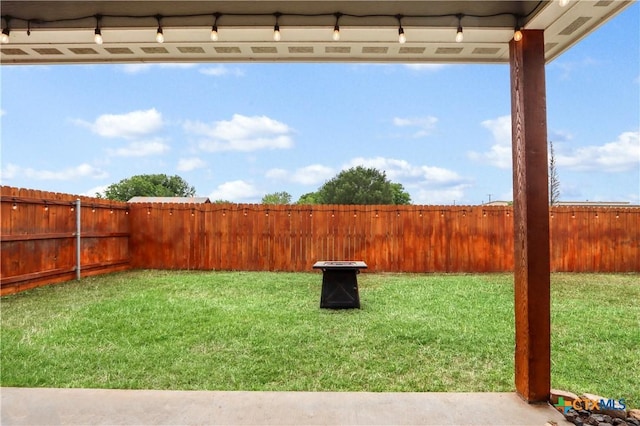 view of yard with a fenced backyard