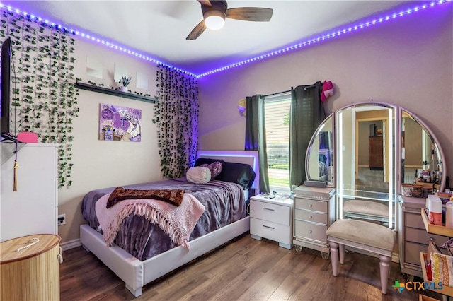 bedroom with a ceiling fan and wood finished floors