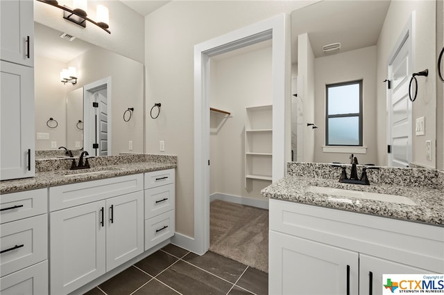 bathroom featuring tile patterned floors and vanity