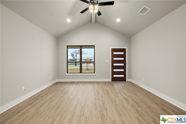 interior space featuring ceiling fan, light wood-type flooring, and high vaulted ceiling