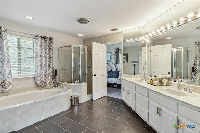 bathroom with vanity, shower with separate bathtub, and tile patterned floors