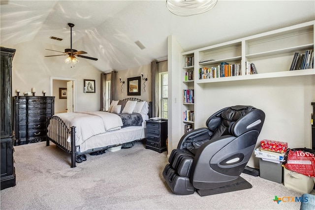 carpeted bedroom featuring lofted ceiling and ceiling fan