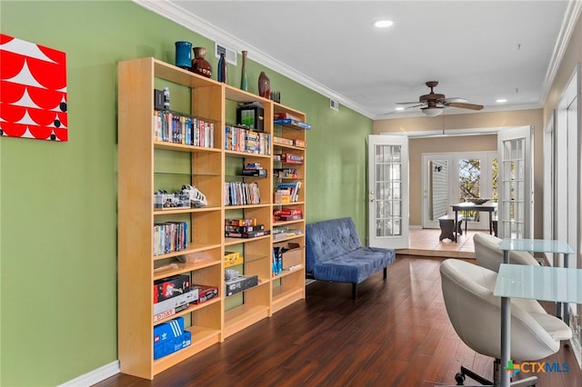 living area featuring a ceiling fan, recessed lighting, ornamental molding, dark wood-type flooring, and french doors