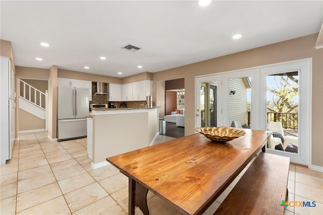 dining area with visible vents, baseboards, light tile patterned flooring, recessed lighting, and stairs