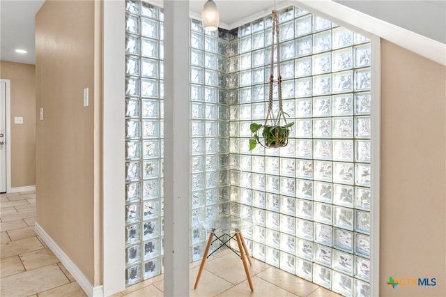 bathroom with tile patterned floors and baseboards