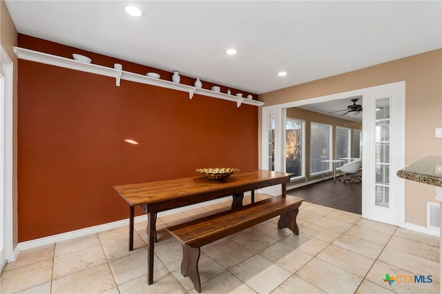 dining space featuring light tile patterned flooring, recessed lighting, and baseboards