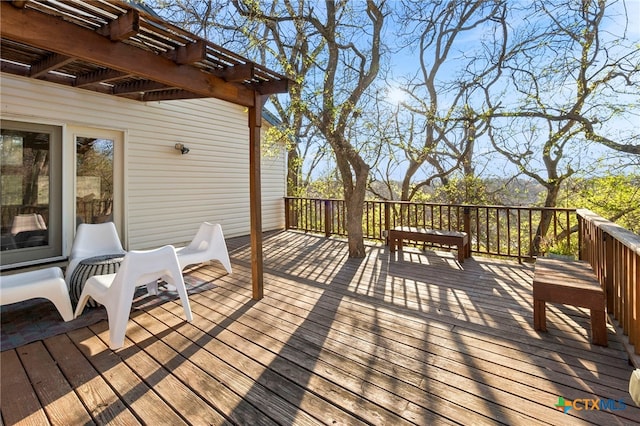 wooden deck featuring a pergola