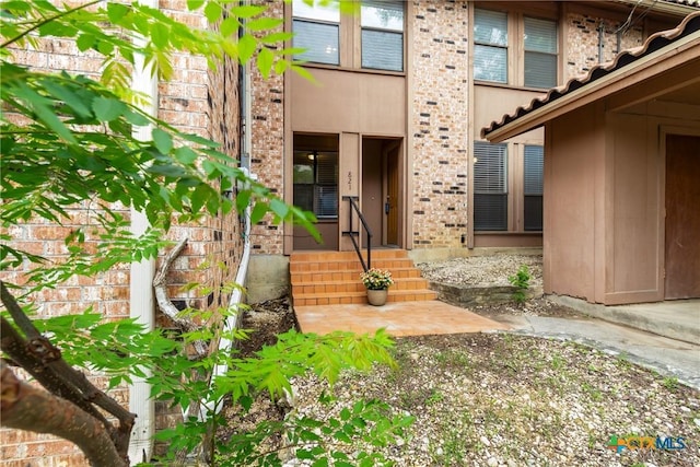 821 Old Ranch Road 12, San Marcos, TX 78666 - view of exterior entry featuring brick siding