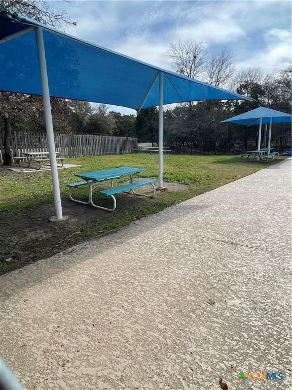 view of playground with a lawn