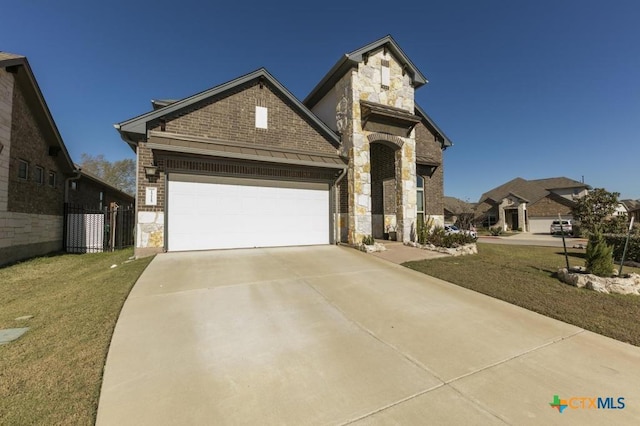 1400 Little Elm Trl Unit 1215, Cedar Park, TX 78613 - view of front of house with stone siding, driveway, a garage, a front lawn, and brick siding