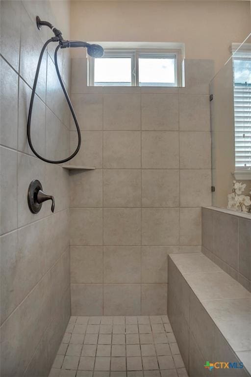 1400 Little Elm Trl Unit 1215, Cedar Park, TX 78613 - bathroom featuring tiled shower and plenty of natural light