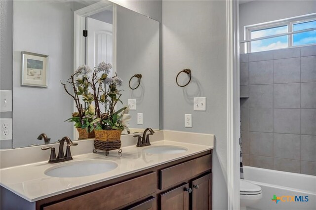 1400 Little Elm Trl Unit 1215, Cedar Park, TX 78613 - bathroom featuring double vanity and  shower combination