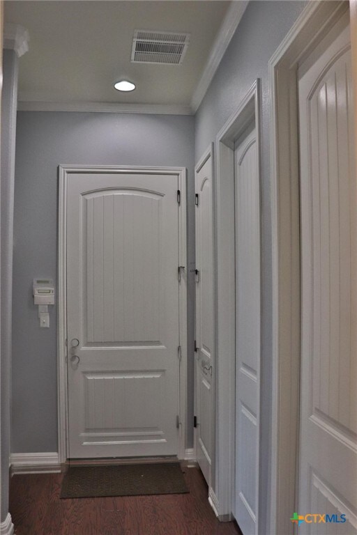 1400 Little Elm Trl Unit 1215, Cedar Park, TX 78613 - entryway with dark wood-style flooring, recessed lighting, and ornamental molding