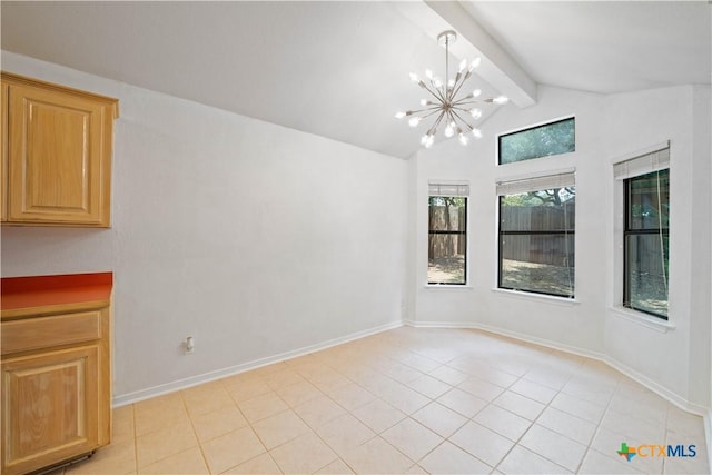 2203 Lancaster St, San Marcos, TX 78666 - unfurnished dining area with a chandelier, light tile patterned floors, and baseboards