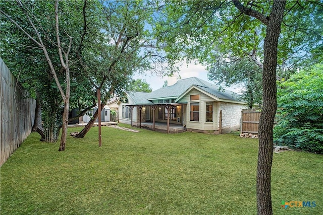 2203 Lancaster St, San Marcos, TX 78666 - rear view of house featuring a patio area