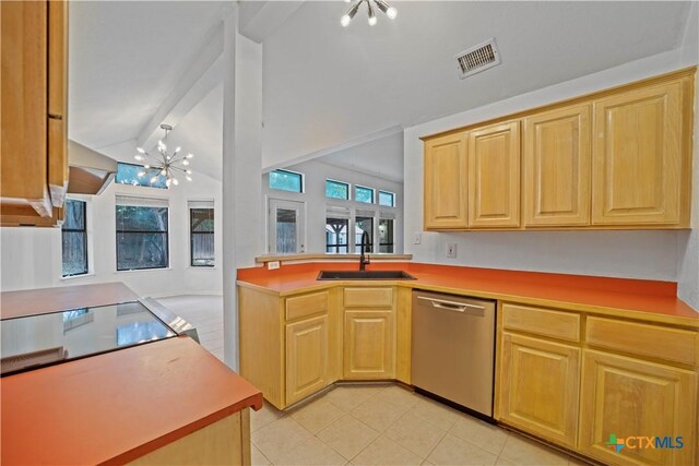 2203 Lancaster St, San Marcos, TX 78666 - kitchen with stainless steel dishwasher, a sink, a chandelier, cooktop, and lofted ceiling