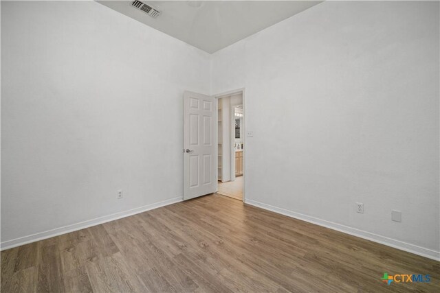 2203 Lancaster St, San Marcos, TX 78666 - spare room featuring wood finished floors and baseboards