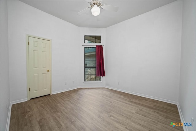 2203 Lancaster St, San Marcos, TX 78666 - empty room featuring wood finished floors, baseboards, and ceiling fan